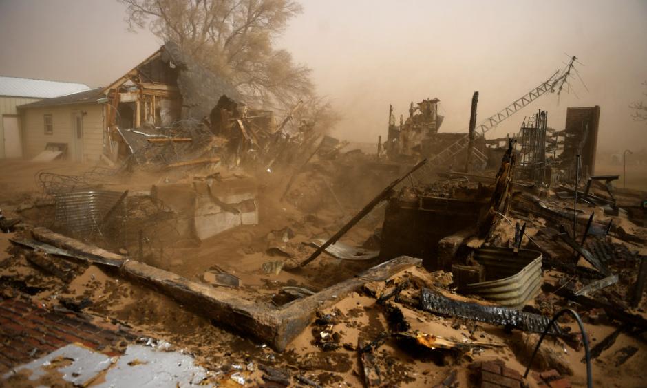 A home that was caught up in a large brush fire driven by high winds near the town of Haxtun in Phillips County, Colorado March 7, 2017. Photo: Joe Amon, The Denver Post