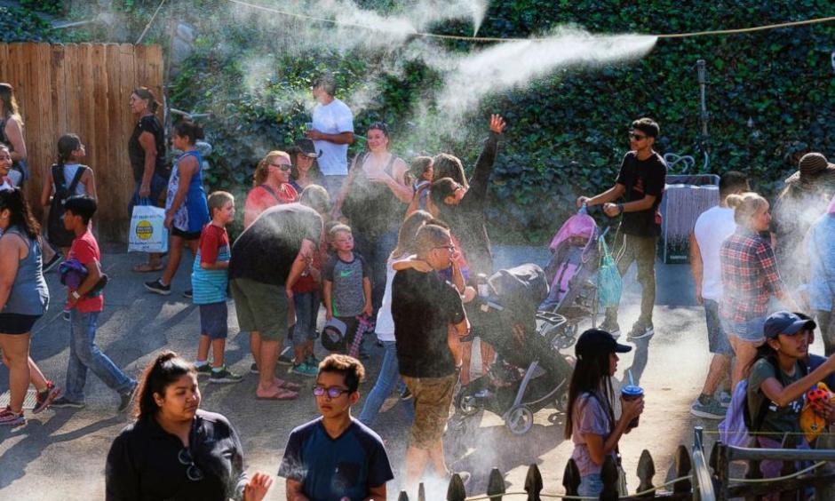 In this Saturday, Sept. 24, 2016 photo, visitors to the Los Angeles County fair cool off under outdoor misters in Pomona, Calif. Californians braced Monday, Sept. 26 for another hot autumn day as forecasters warned of soaring temperatures and potential wildfires due to hot, dry and windy conditions. Photo: Richard Vogel, AP