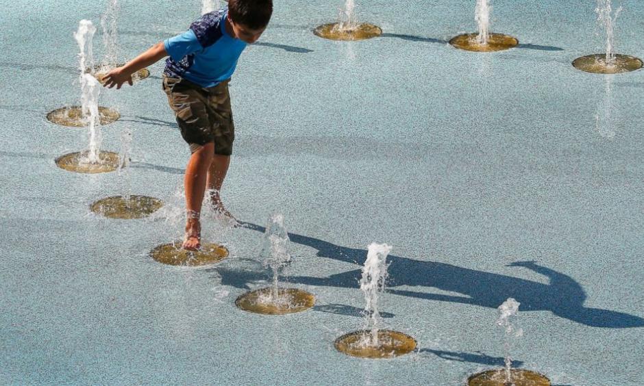One person uses the CityScape splash pad to stay cool as temperatures climb to near-record highs Tuesday, June 20, 2017, in Phoenix. The National Weather Service forecasts a high of 120 degrees (49 degrees Celsius), which is has only hit three times in recorded history in Phoenix, the last time 22 years ago. Photo: Ross D. Franklin, AP
