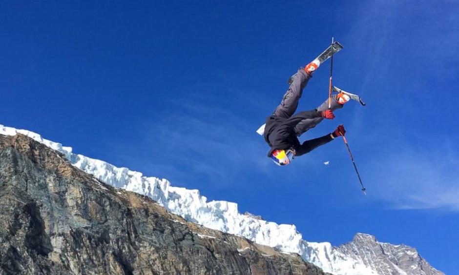 This photo taken from a 4K video and dated Wednesday, Oct. 18, 2017 shows a skier performing a jump during training on the glacier above Saas-Fee, Switzerland. The glacier attracted skiers and snowboard athletes from an array of nations, who came hunting for snow on which to train early in the season ahead of the 2018 Pyeongchang Olympics. Photo: John Leicester, AP