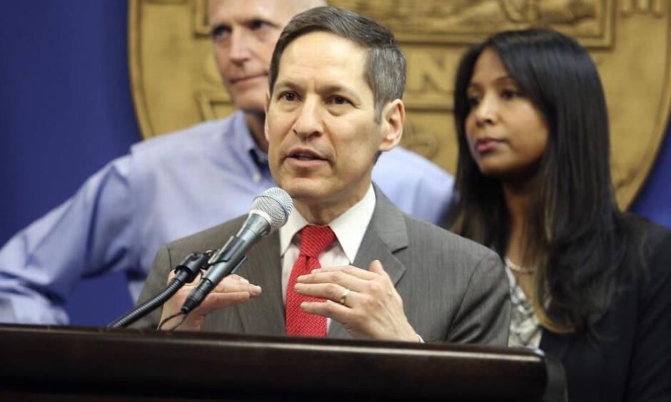 Dr. Tom Frieden, director of the Centers for Disease Control and Prevention (CDC), center, with Florida Gov. Rick Scott and Florida Surgeon General Dr. Celeste Philip, speaks about local effforts to combat the Zika virus, during a press conference in August 2016 at the Miami-Dade County Emergency Operations Center. Frieden said Tuesday that Zika virus likely will become endemic in Western Hemisphere. Photo: Marsha Halper, Miami Herald