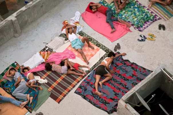 People laying on blankets amid extreme heat.