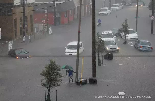 Cars and people in the floodwaters near the Municipal Auditorium as a torrential downpour flooded city streets on Saturday, August 5, 2017. Photo: Michael DeMocker, NOLA.com | The Times-Picayune