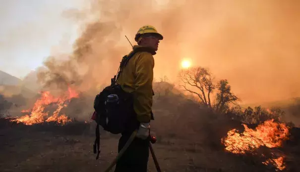 An air tanker drops fire retardant on homes threatened by the Sand Fire as firefighters continue to battle the Sand Fire on Monday, July 25, 2016. Photo: RMG News