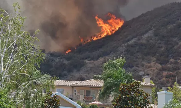 The Sage Fire burns Saturday, July 9, 2016, near a home on Morning Mist Drive in Santa Clarita. Photo: Rick McClure / Special to the Los Angeles Daily News