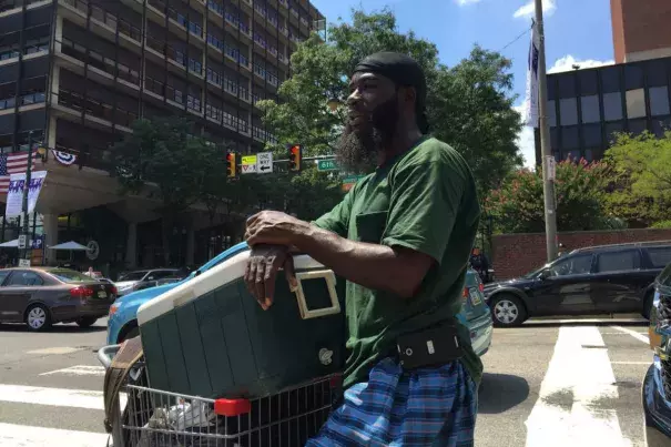 Though the weather had cooled somewhat on Wednesday, Daryl Hadden did a brisk business in water bottles at the corner of 6th and Market Streets on Wednesday, July 27, 2016. Photo: Tom Avril, Philly.comThe nights are getting hotter in Philadelphia, and it has nothing to do with nightlife.  Overnight temperatures have been creeping upward for the last 25 years, more robustly than daytime highs, and health experts say that is a cause for concern.  An analysis of daily minimum temperatures showed that between 1