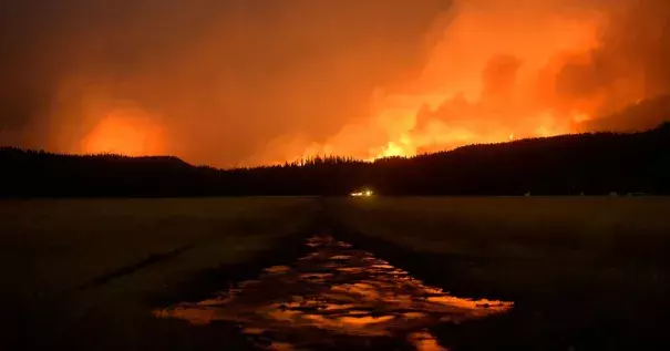 A wildfire burned in the Lolo National Forest near Salmon Lake in Montana in August. Credit Rion Sanders/The Great Falls Tribune, via Associated Press