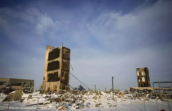 The charred remains of an Element Hotel destroyed by wildfires Thursday, Jan. 6, 2022, in Superior, Colo. Colorado authorities said Thursday, that last week's wildfires caused $513 million in damage and destroyed 1,084 homes and structures. (AP Photo/David Zalubowski)