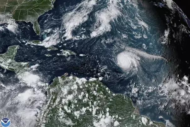 FILE - This satellite image provided by the National Oceanic and Atmospheric Administration shows Hurricane Sam, center right, in the Atlantic Ocean, Monday, Sept. 27, 2021, at 3:20 p.m. ET. On Tuesday, May 24, 2022, federal meteorologists say the Atlantic should expect another extra busy hurricane season in 2022. Tuesday's National Oceanic and Atmospheric Administration's Atlantic hurricane season forecast calls for 14 to 21 named storms, with six to 10 becoming hurricanes. (Credit: NOAA via AP, File)