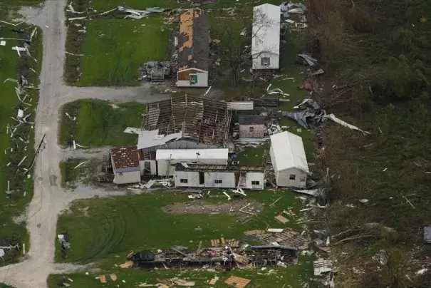 In this aerial photo, the remains of destroyed homes are seen in the aftermath of Hurricane Ida, Sept. 6, 2021, in Lafitte, La. Damage wrought by Hurricane Ida in the U.S. state of Louisiana and the flash floods that hit Europe last summer have helped make 2021 one of the most expensive years for natural disasters. Reinsurance company Munich Re said Monday, Jan. 10, 2022 that overall economic losses from natural disasters worldwide last year reached $280 billion. (AP Photo/Matt Slocum)