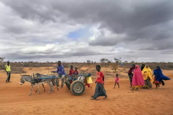 Mohamed Ahmed Diriye arrives with others to a displacement camp on the outskirts of Dollow, Somalia, on Tuesday, Sept. 20, 2022. Somalia is in the midst of the worst drought anyone there can remember. A rare famine declaration could be made within weeks. Climate change and fallout from the war in Ukraine are in part to blame. (AP Photo/Jerome Delay)