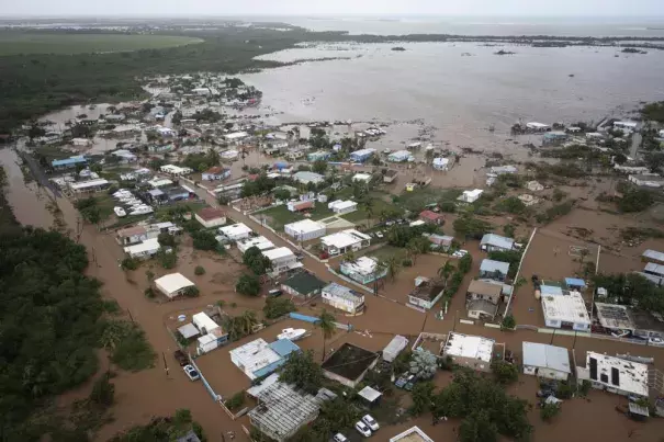 Homes are flooded on Salinas Beach after the passing of Hurricane Fiona in Salinas, Puerto Rico, Monday, Sept. 19, 2022. (AP Photo/Alejandro Granadillo)