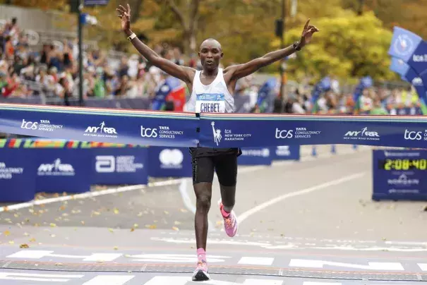 Evans Chebet, of Kenya, crosses the finish line first in the men's division of the New York City Marathon, Sunday, Nov. 6, 2022, in New York. (Credit: AP Photo/Jason DeCrow)