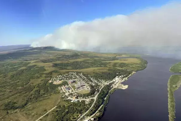 This June 10, 2022, aerial photo provided by the Bureau of Land Management Alaska Fire Service shows a tundra fire burning near the community of St. Mary's, Alaska. The largest documented wildfire burning through tundra in southwest Alaska was within miles St. Mary's and another nearby Alaska Native village, Pitkas Point, prompting officials Friday to urge residents to prepare for possible evacuation. (Credit: Ryan McPherson/Bureau of Land Management Alaska Fire Service via AP)