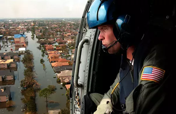 A U.S. Coast Guardsman searches for survivors in New Orleans in the Katrina aftermath. Photo: Wikipedia