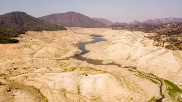 A nearly empty Lake Oroville is seen from above in Oroville, California on September 5, 2021. (Credit: Josh Edelson/AFP/Getty Images)