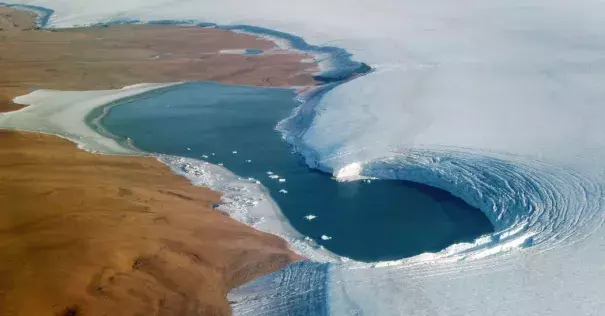 A lake on the edge of the Humboldt Glacier in Greenland in September. Credit: NASA/EPA