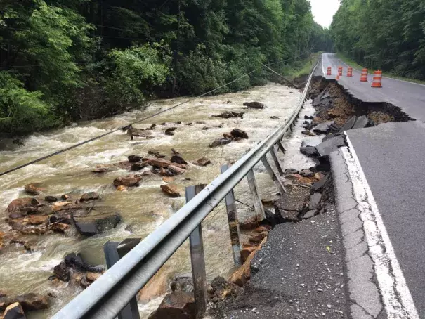 A powerline toppled into Brackens Creek next to a washout of WV Route 60 between Lookout and Hilton VIllage. Photo: Rebecca Lindsey