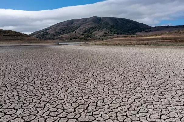 A cracked lake bed at Nicasio Reservoir during a drought in Nicasio, California