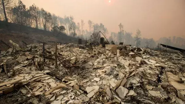 Rubble lines a residence leveled by the Loma fire along Loma Chiquita Road on Tuesday, Sept. 27, 2016, near Morgan Hill, Calif. Photo: Noah Berger, AP