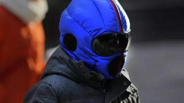 A bundled-up pedestrian walks along Summer Street amid cold weather in Boston on Jan. 2, 2017. Photo: Lane Turner, The Boston Globe via Getty Images