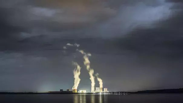The lignite-fired power station of Boxberg is pictured at night on April 28, 2018 in Klitten, Germany. Photo: Florian Gaertner, Photothek via Getty Images