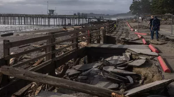 A sunken section of a parking lot after a rain storm at Seacliff State Beach in Aptos, California, on Sunday. (Credit: Nic Coury/Bloomberg via Getty Images)