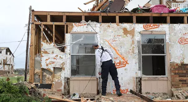 A member of the Texas Task Force 2 search and rescue team works through a destroyed apartment complex trying to find anyone that still may be in the building after Hurricane Harvey passed through on Sunday in Rockport, Texas. Photo: Joe Raedle/Getty Images