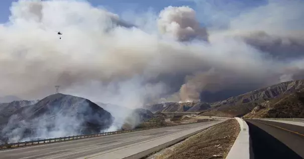 As of Tuesday night, more than 80,000 people had to evacuate because of the fire. Photo: Reuters and KESQ via Associated Press