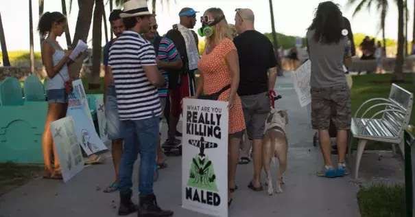 Demonstrators and Miami-Dade County residents during a protest in Miami Beach on Friday against the spraying of the pesticide naled. Photo: Max Reed for The New York Times