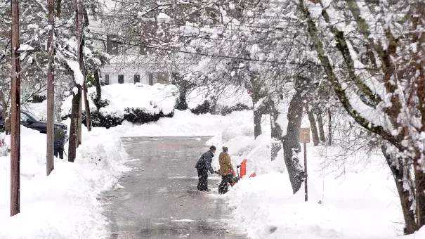 Neighbors dig out a driveway on Rockhill Street in Foxboro, Massachusetts, Monday, March 4, 2019, after the area received well over a foot of snow in an overnight storm. Photo: Mark Stockwell, AP
