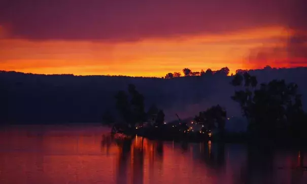 Embers glow against the smoke-filled sunset near Gumeracha in the Adelaide Hills. Photo: Brenton Edwards, AFP, Getty Images