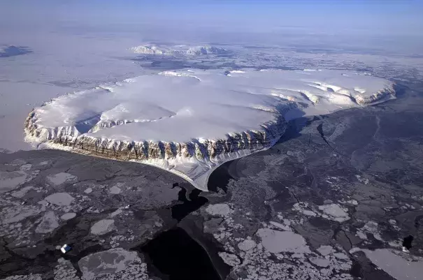 Saunders Island and Wolstenholme Fjord with Kap Atholl in the background are seen in an image taken during an Operation IceBridge survey flight of Greenland in April 2013. Photo: Michael Studinger, NASA/Reuters