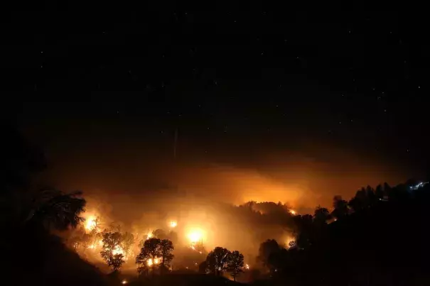 A backfire to head off the Rocky Fire glows on August 3, 2015 near Clearlake, California. Image: Justin Sullivan, Getty Images