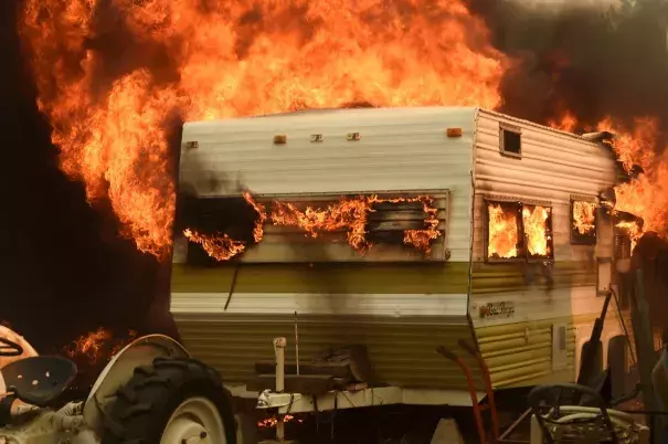 Flames from the Erskine fire engulf a trailer near Weldon, Calif., on June 24. Photo: Noah Berger / Reuters