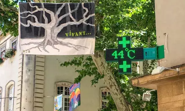 A sign outside a pharmacy in Carpentras, south-eastern France, shows a temperature of 44C on Friday. Photograph: Patrick Valasseris/AFP/Getty Images