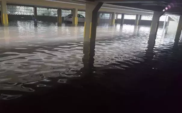 Water pools in a parking garage at 1441 Lincoln Rd. Wednesday evening during high tide. Photo: Valerie Navarrete