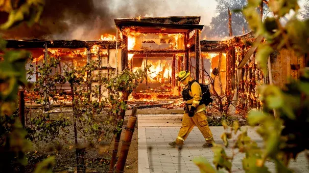 Firefighters try to save a home on Tigertail Road from the Getty fire, Oct. 28, 2019, in Los Angeles. Credit: USA Today