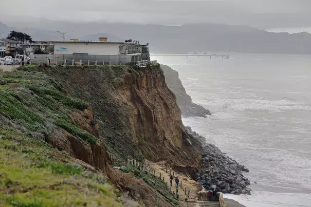 Apartments sit on the edge of an eroding coastal bluff in Pacifica, Calif. Photo: Eric Risberg, AP