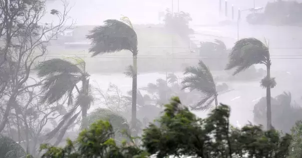 Winds of up to 160 miles an hour hit the resort town of Airlie Beach on Tuesday, damaging roofs and knocking over palm trees. Photo: Dan Peled, Australian Associated Press, via Reuters
