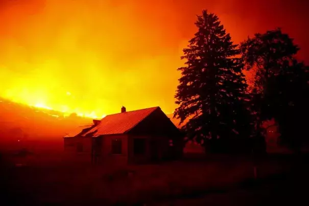 Flames blanket the hillsides on Twisp River Road just outside of the town of Twisp, Wash. last week. More than 900,000 acres have already burned this year in Washington wildfires. Photo: Erika Schultz, The Seattle Times