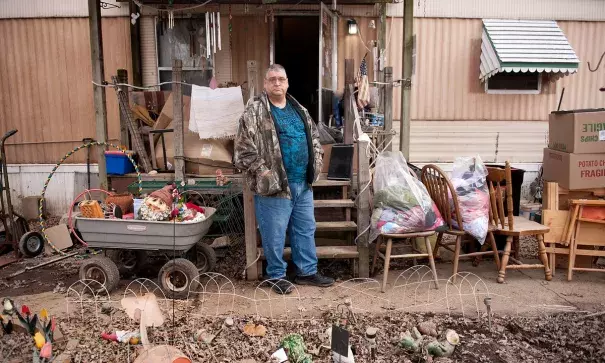 Damon Thorne poses for a photograph with items salvaged from his home, flooded last week by water from the nearby Meramec River, in a trailer park near Arnold, Missouri. Photo: Sid Hastings, The Guardian