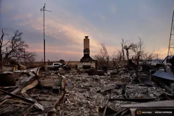 A chimney is all that stands in the footprint of a home destroyed by wildfires near Laverne, Okla., on March 12, 2017. Credit: Lucas Jackson, Reuters