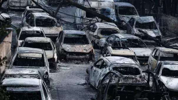 In Mati, many fled their cars and ran for the sea to try to escape the flames. By Tuesday morning, burned-out vehicles lined the coastal village. Photo: Nick Paleologos, SOOC/Al Jazeera