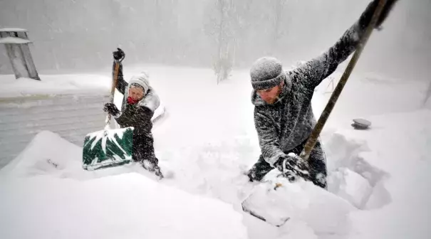 Hardy Buffalonians dig out from the massive storm. Photo: John Normile, Getty Images