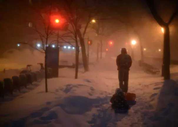 Children are pulled home after playing at Riverside Park, which was covered in snow after a day of constant snowfall in New York City on Jan. 23, 2016—the city’s snowiest day ever. Photo: Astrid Riecken, Getty Images