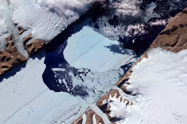 This NASA Earth Observatory image obtained July 27, 2012, shows a massive ice island as it broke free of the Petermann Glacier in northwestern Greenland. Photo: Jesse Allen and Robert Simmon, NASA Earth Observatory via AFP