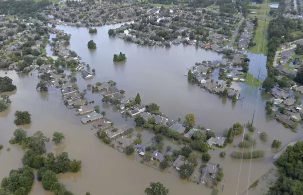 Homes are surrounded by water in the Manchac Harbor subdivision off LA-42. Aerials of severe weather flooding in Ascension Parish on Monday August 15, 2016. Photo: Bill Feig, The Advocate