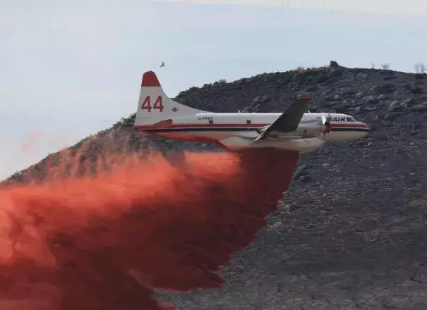 An air tanker drops retardant on the wildfire burning near Idaho Falls. Fire officials announced Sunday that the blaze was nearly 70 percent contained. Photo: Eastern Idaho Interagency Fire Center