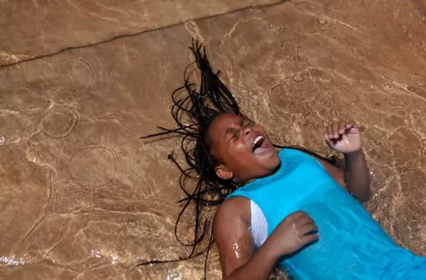 Trelynn Watkins, 10, laughs as she plays in the Julia Primrose Fountain. Credit: Genna Ord, The Gazette